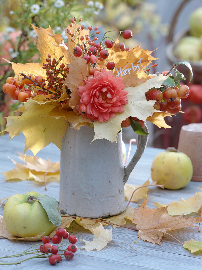 Autumn bouquet of leaves in the jug