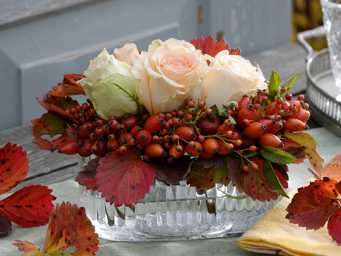 Autumn arrangement in elongated glass bowl