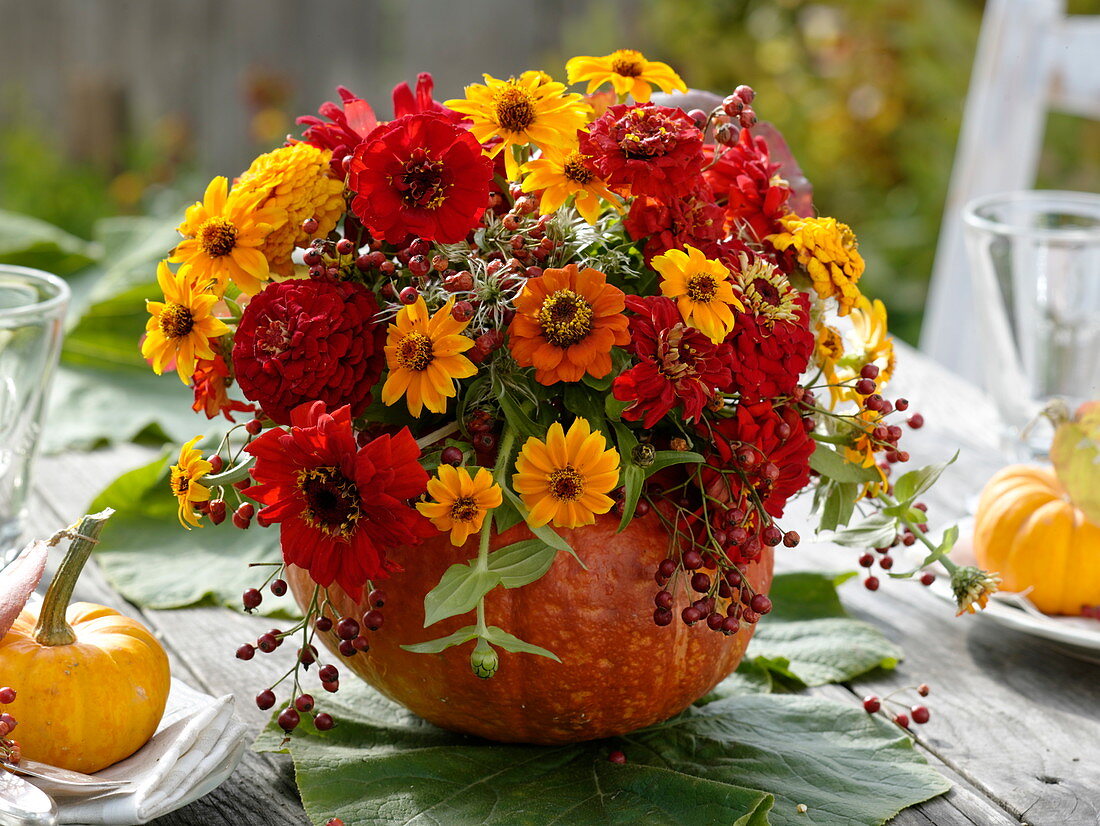 Hollow pumpkin as a vase with bouquet