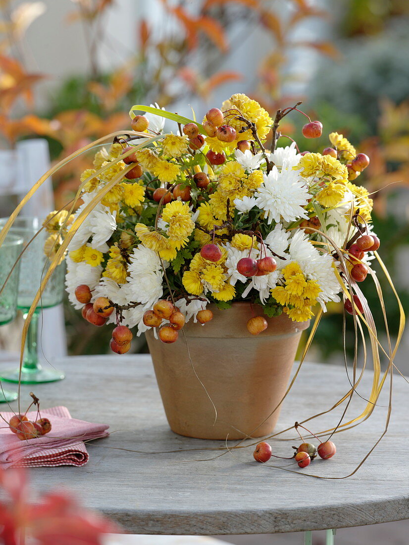 White-yellow autumn bouquet with ornamental apples