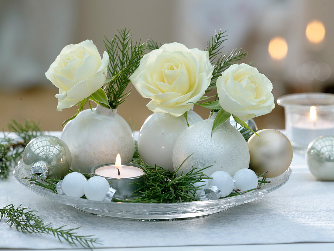 White tree balls as vases with rose and cryptomeria