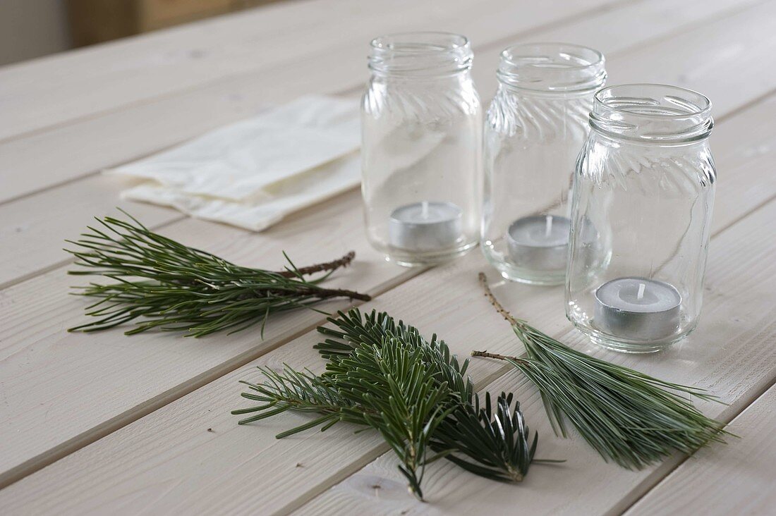 Lanterns with bsandwish bags and coniferous branches