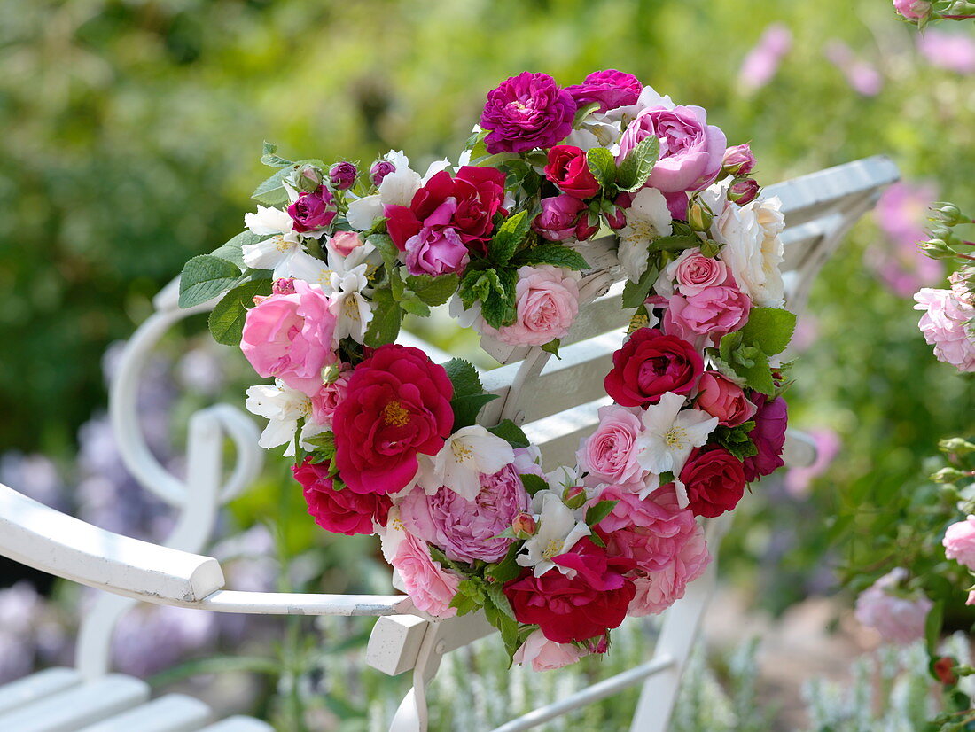 Heart of mixed roses with mint