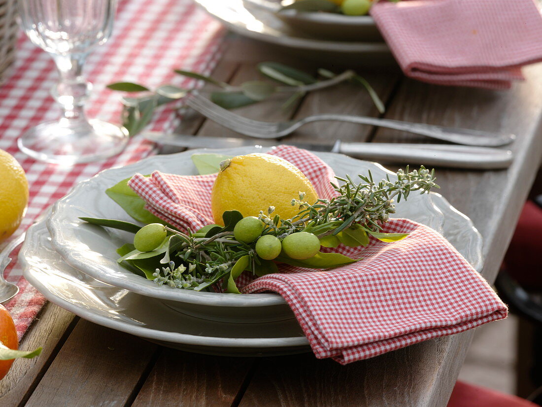Table decoration with citrus fruits and olives