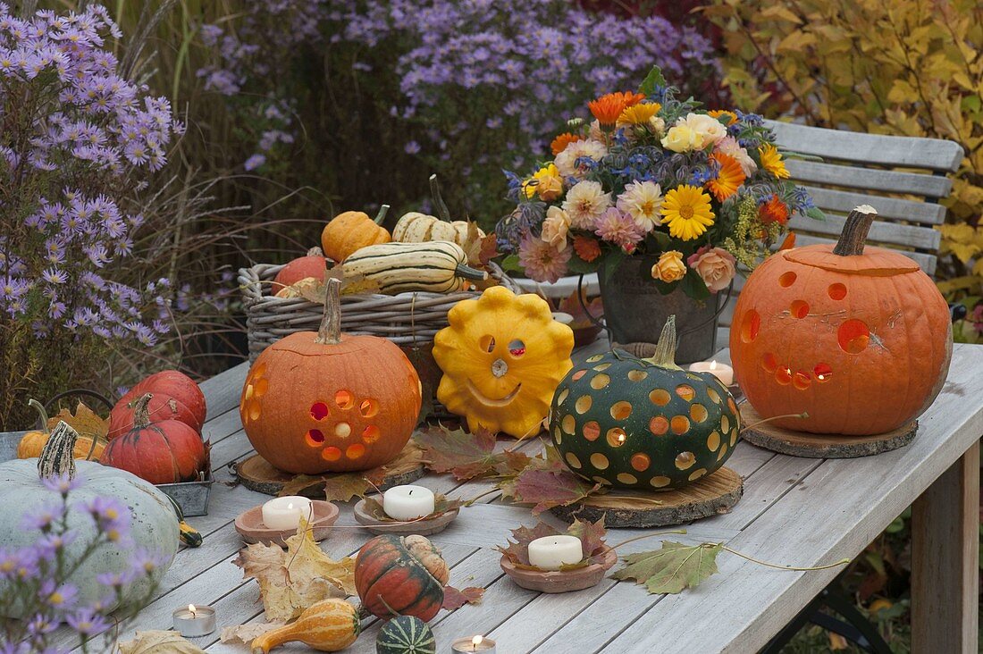 Autumnal arrangement with pumpkins on wooden table