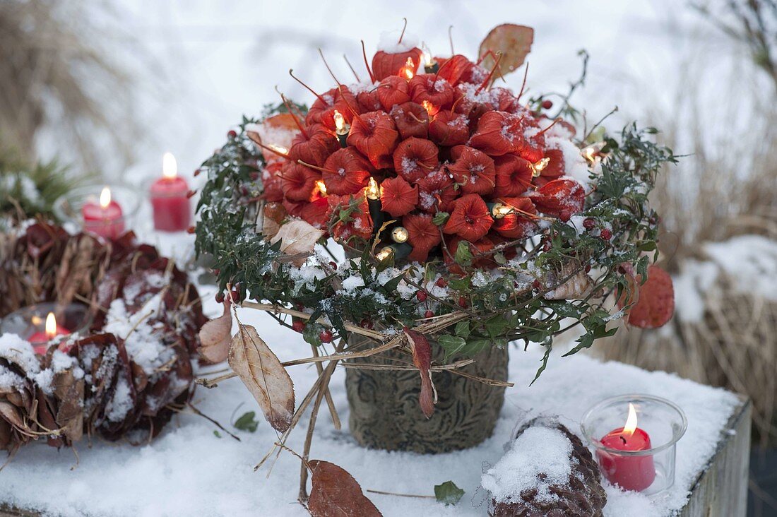 Winter bouquet made of physalis (lantern flower) with fairy lights
