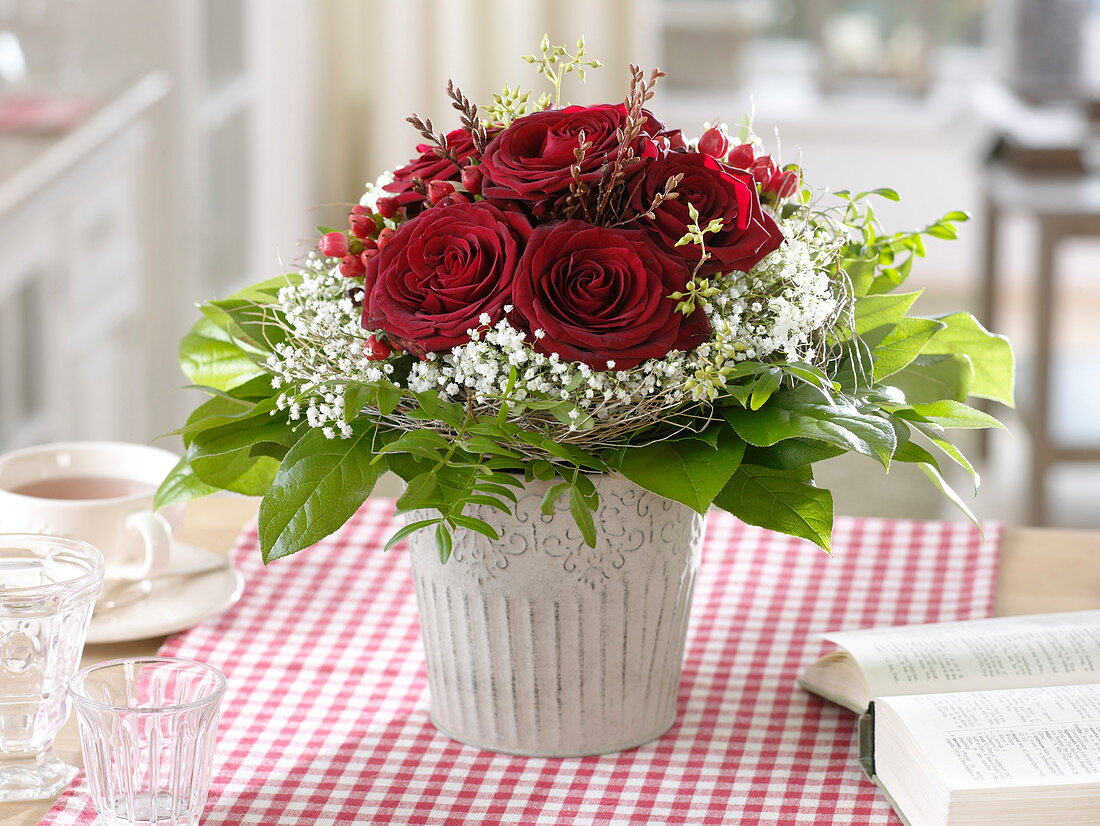 Bouquet of dark red rose, gypsophila