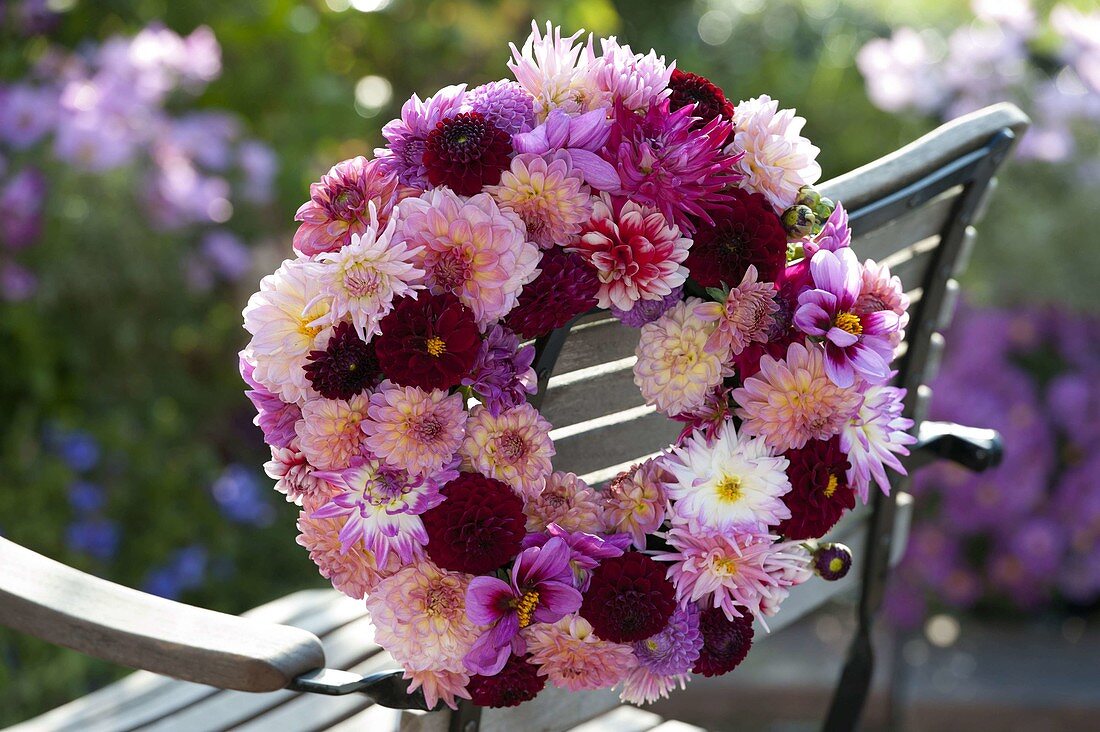Attached wreath of mixed Dahlia on the back of the chair