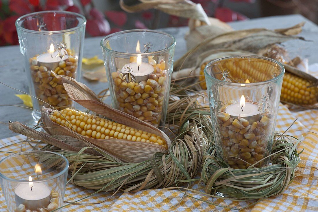 Bienchenglas glasses with corn kernels and tealights as lanterns