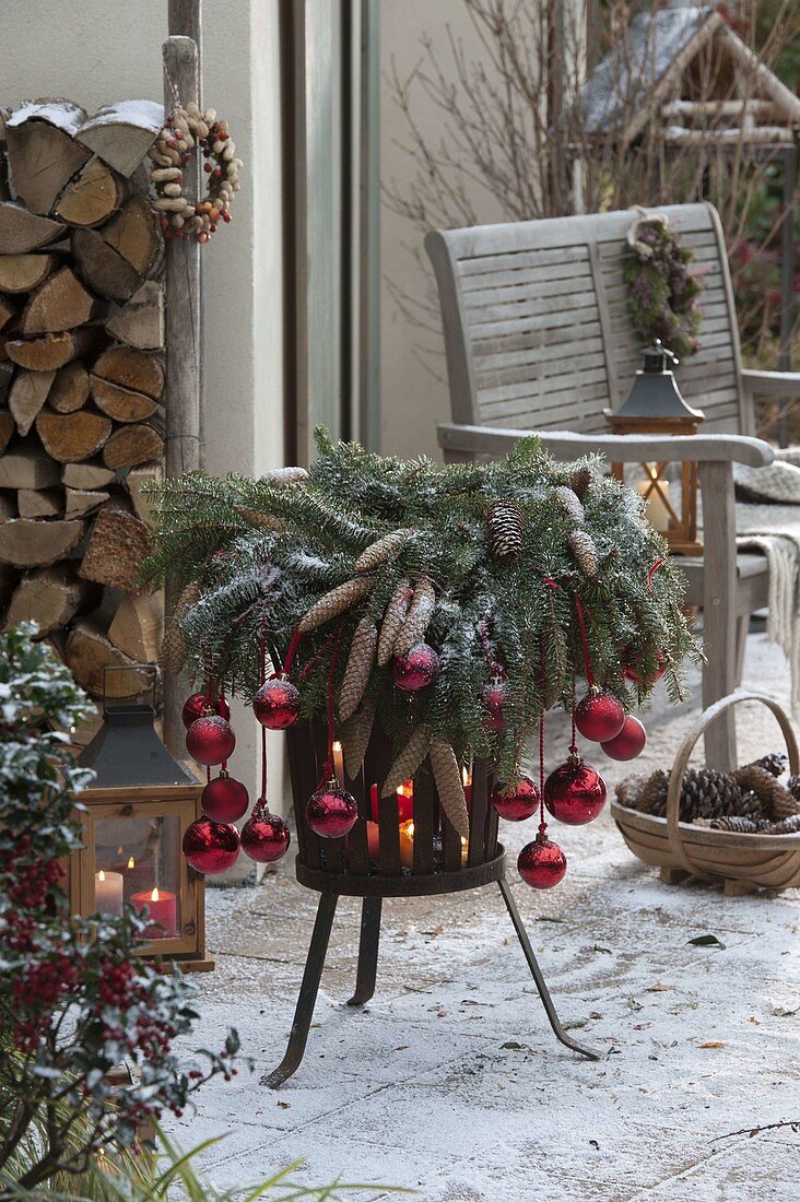 Christmas decorated iron fire basket with Picea wreath