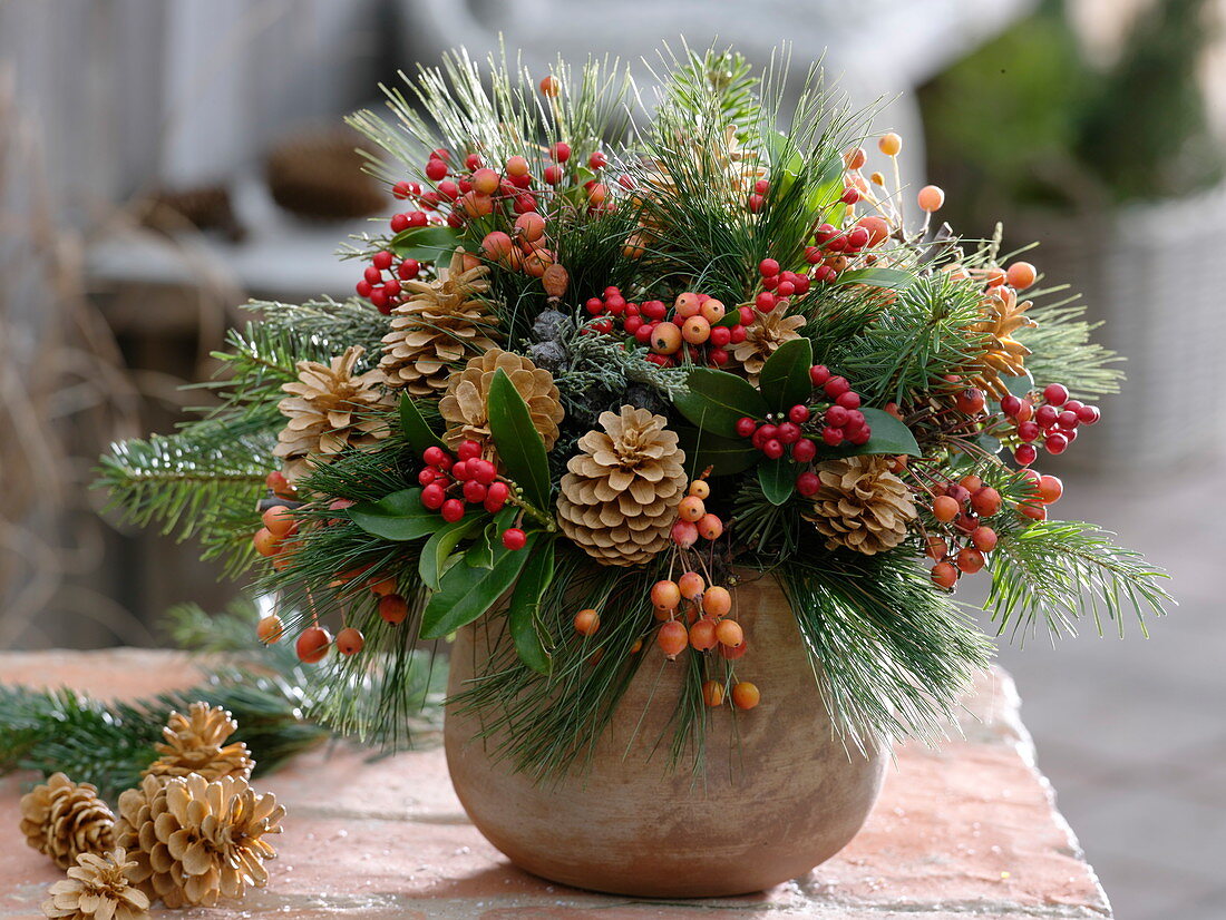 Winter bouquet with Skimmia, bleached cones