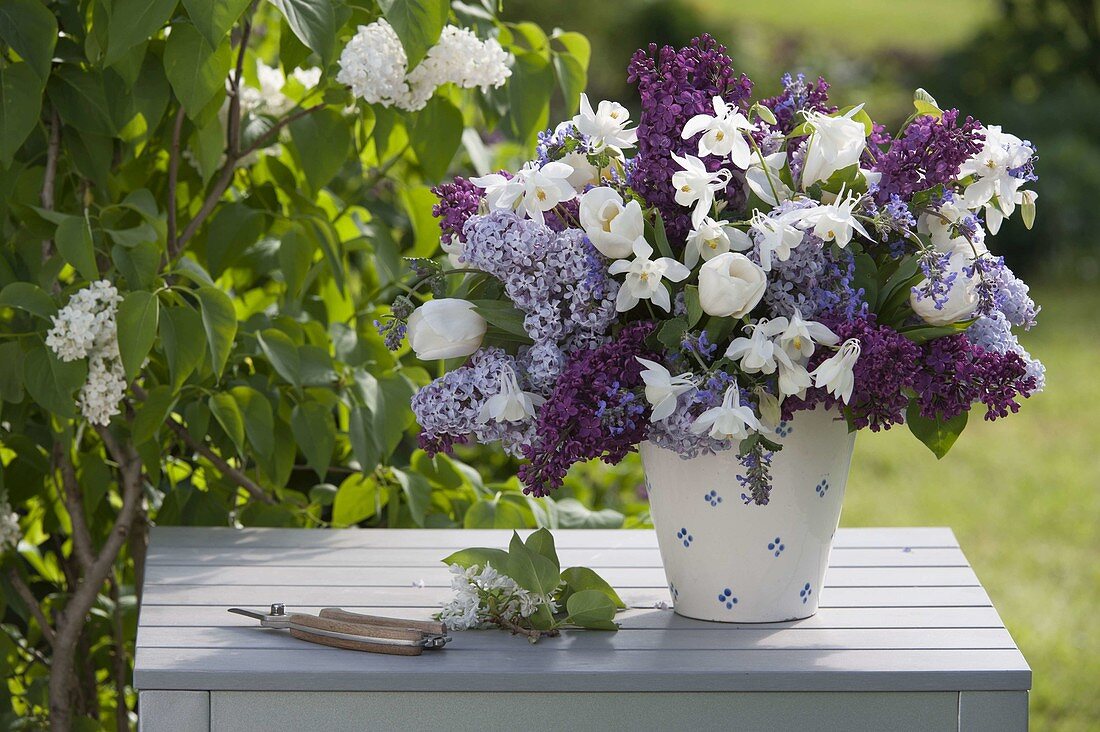 Woman puting fragrant spring bouquet