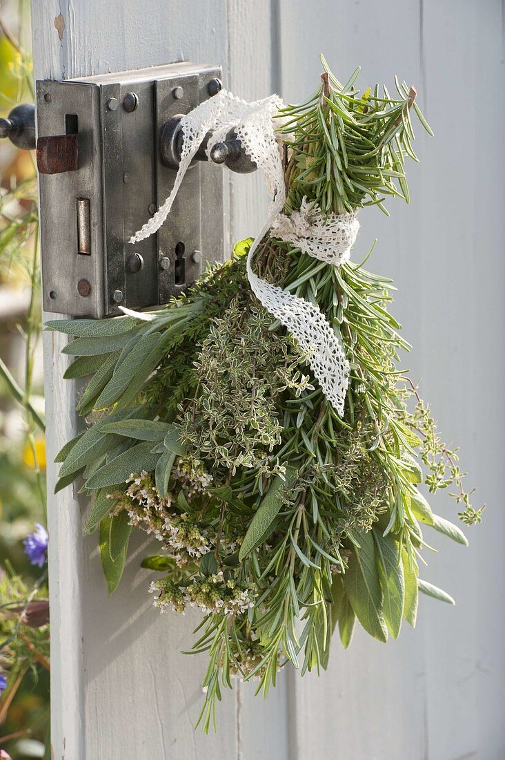Herbal bouquet on the door handle