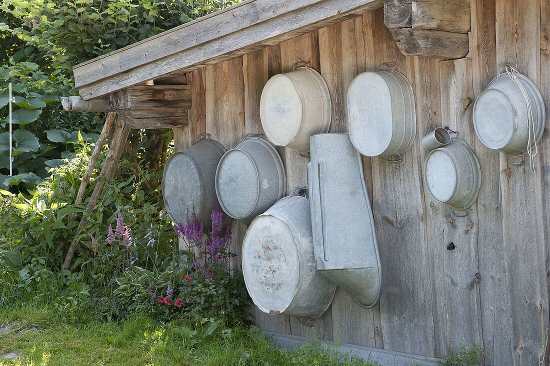 Old zinc tubs hung on shed wall