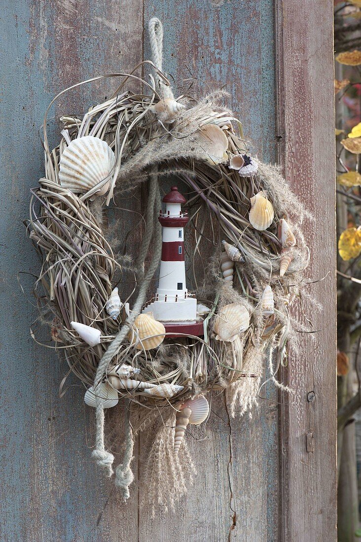Wreath of dry miscanthus wound, maritime decorated