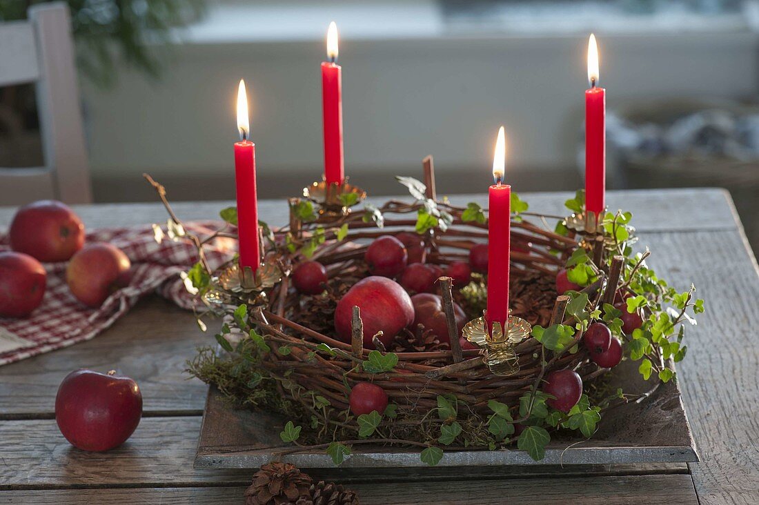 Wickerwork as Advent wreath with apples, ornamental apples (Malus), tendril