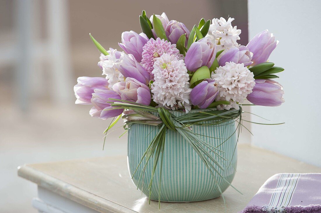 Pastel scented bouquet of Hyacinthus (hyacinths) and Tulipa (tulips)
