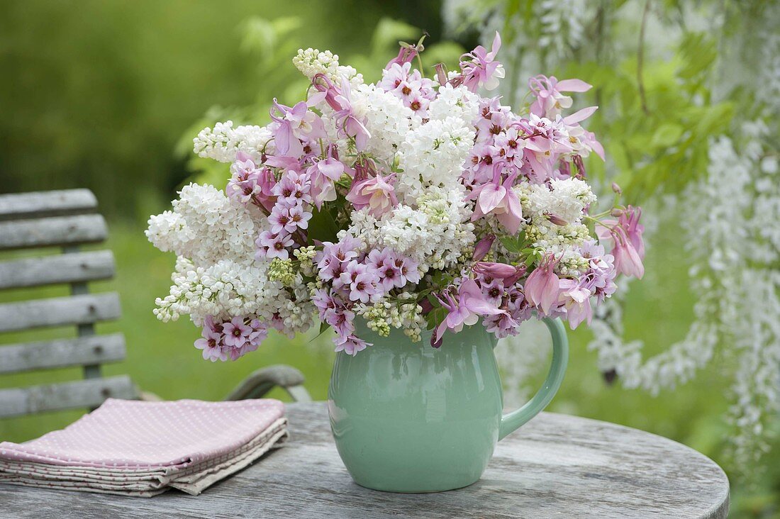 Pink and white bouquet of Syringa, Aquilegia