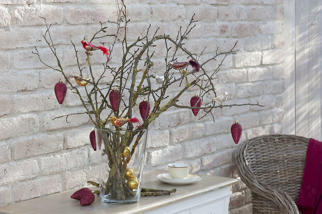 Christmas bouquet made of dry branches with tree decorations