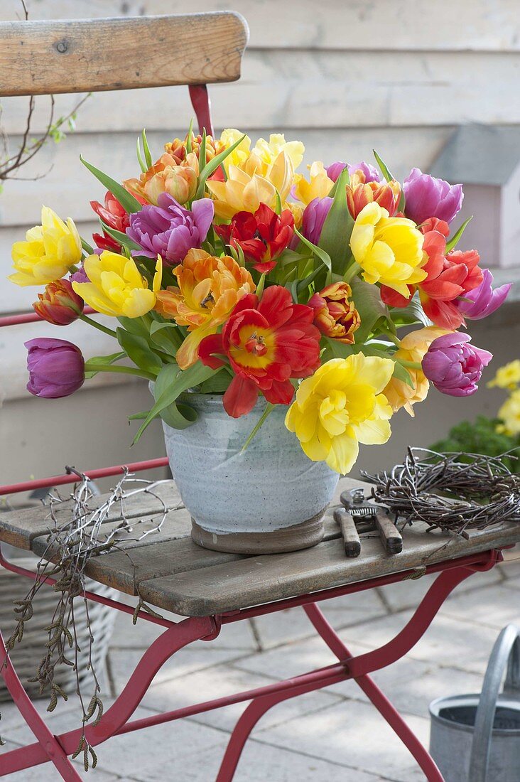 Colorful tulipa (tulip) bouquet in hand-made pot