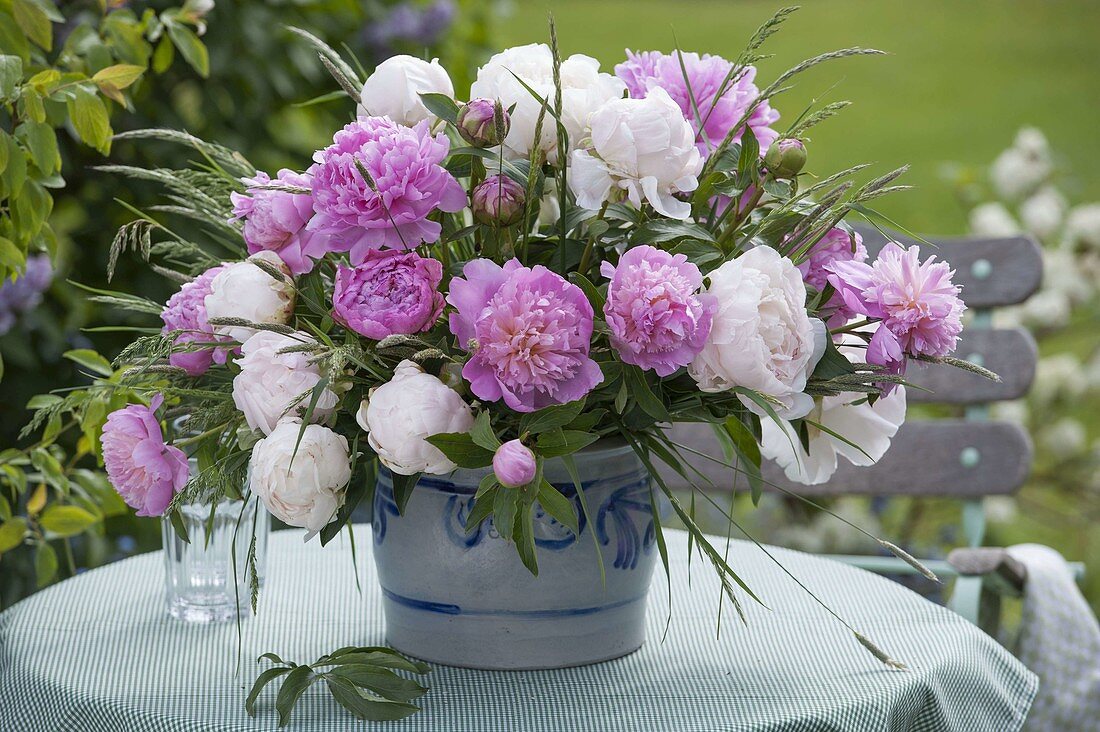 Lush Paeonia and grasses bouquet in salt glaze pot