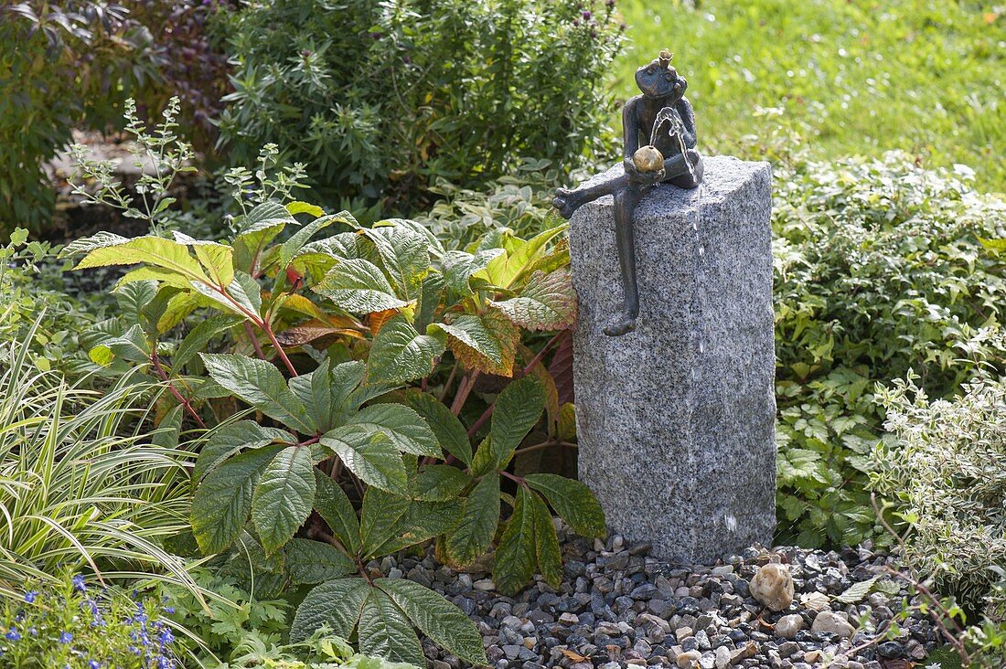 Build up water game with frog on granite pillar