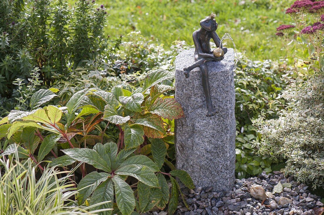 Build up water game with frog on granite pillar