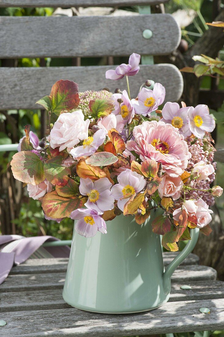 Pink autumn bouquet on garden chair, Zinnia, pink, anemone