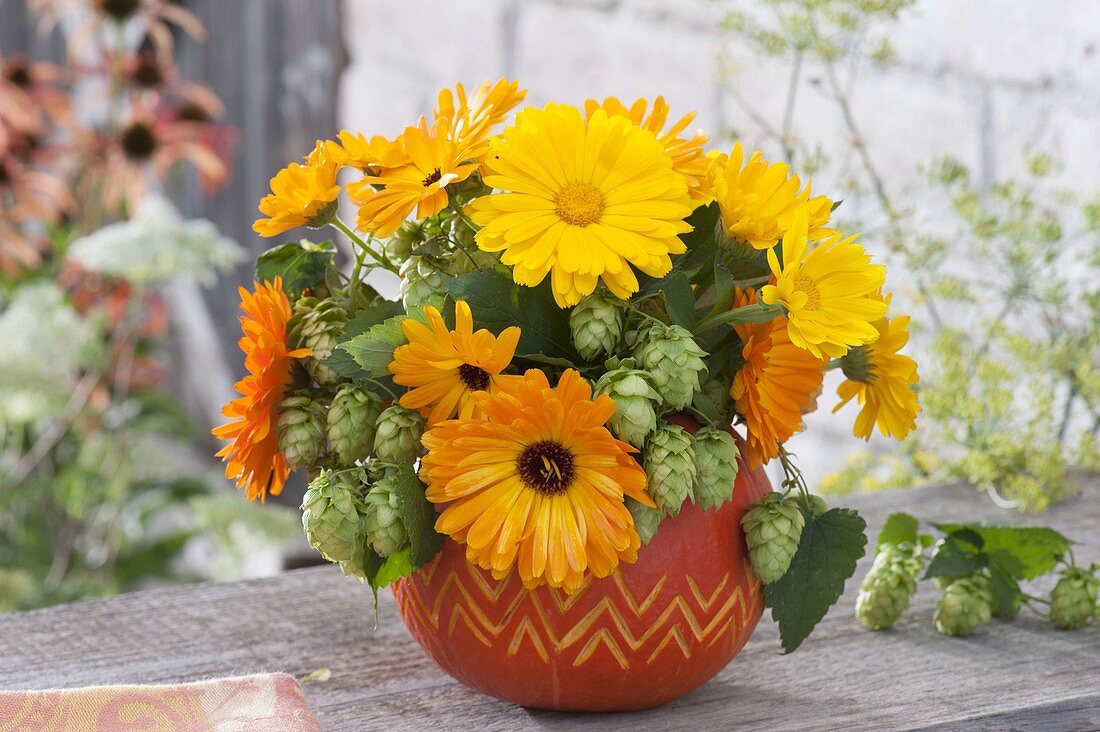 Late summer bouquet in pumpkin vase