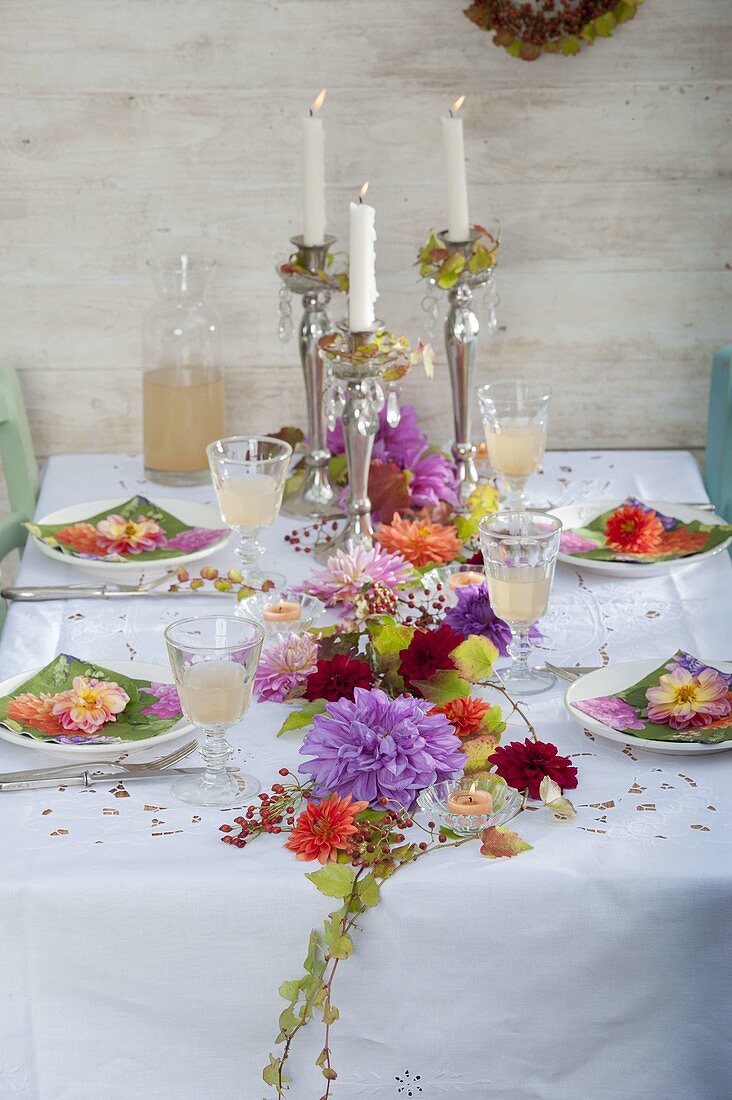 Table decoration with garland of flowers of Dahlia