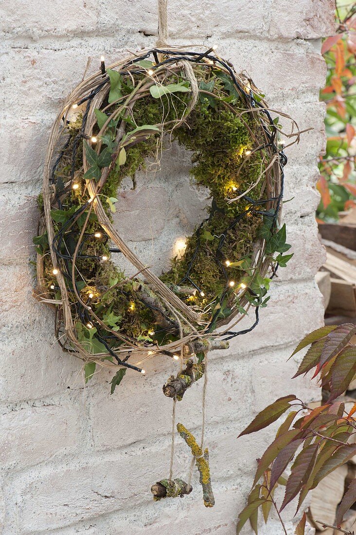 Moss wreath with hedera, clematis tendrils, lichen-covered