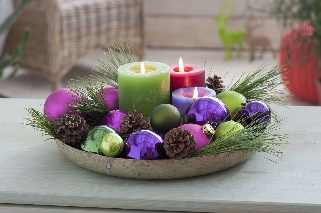 Bowl with candles, balls, cones, pinus (pine) branches