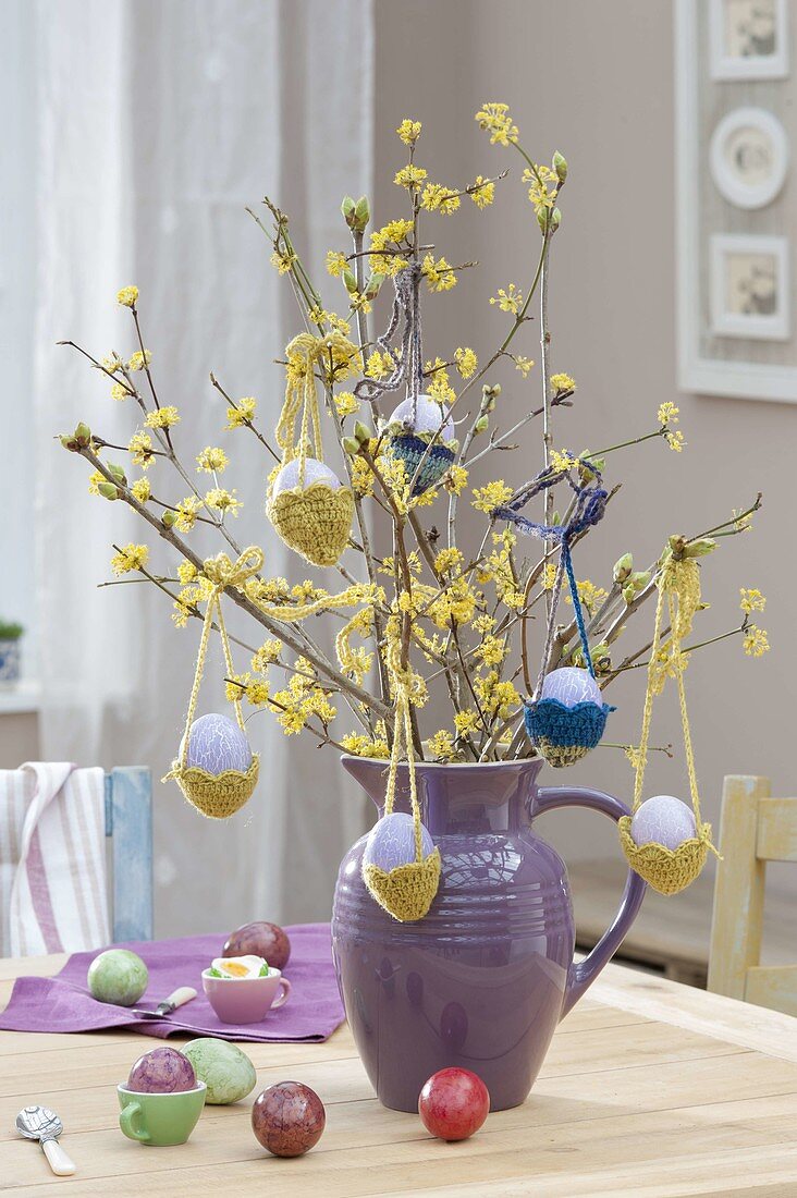 Easter bouquet of Cornus mas branches, easter eggs
