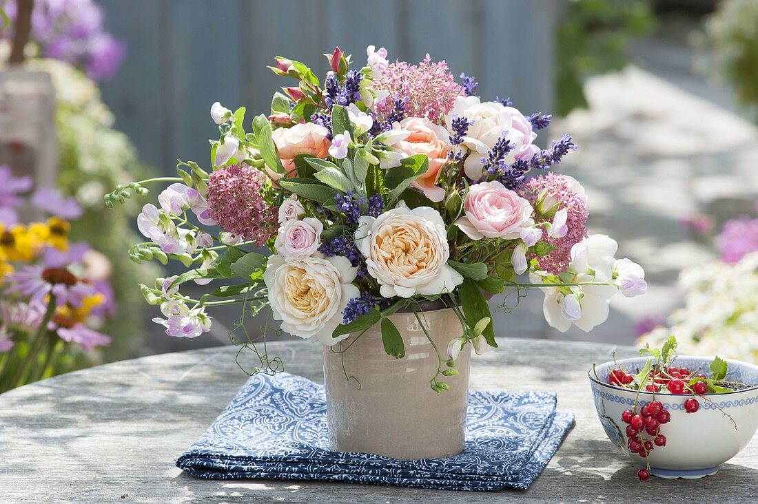 Fragrant summer bouquet of roses, lathyrus, hydrangea