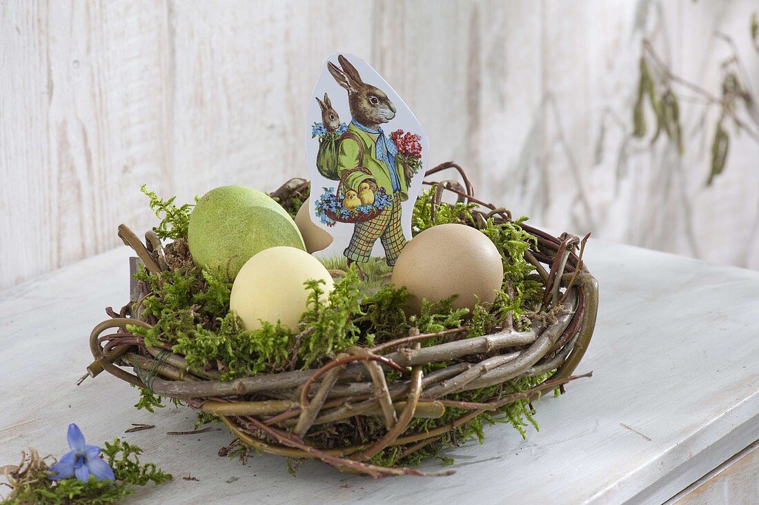 Easter nest with moss, Easter wafer 'easter bunny' and easter eggs