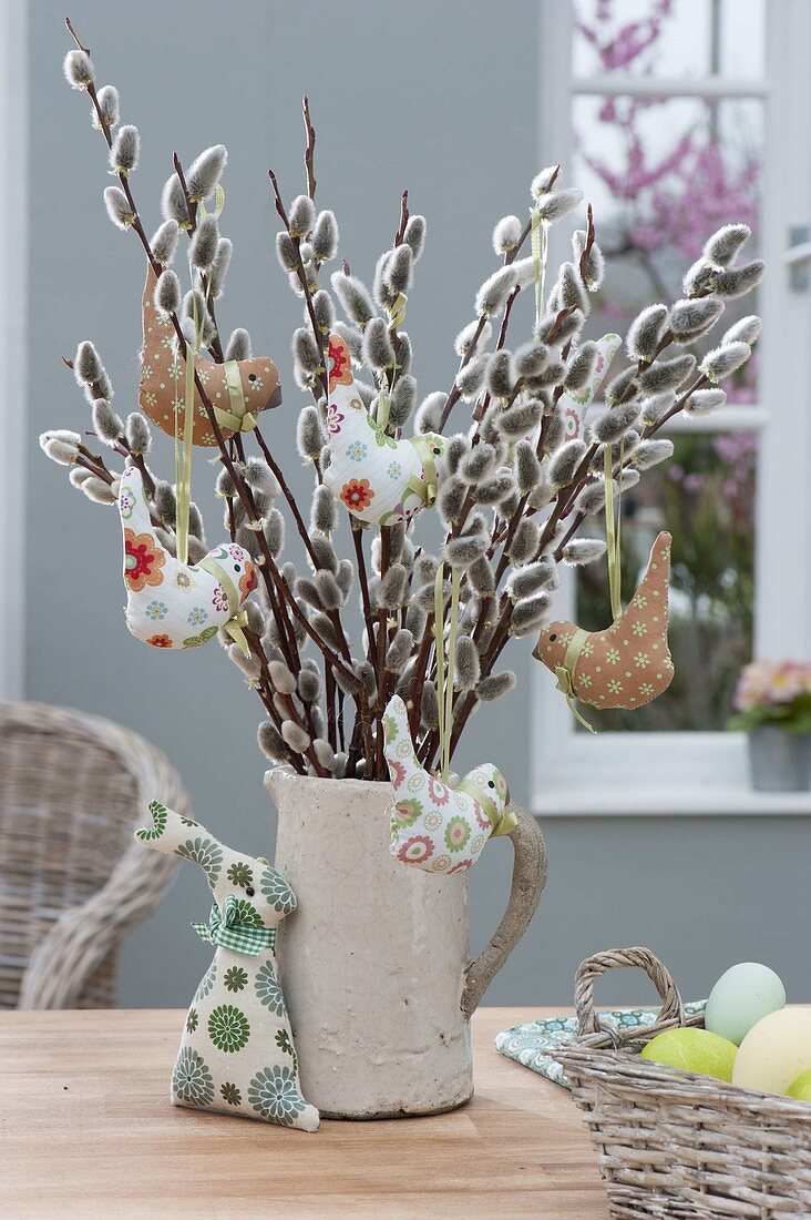 Salix bouquet with birds in white jug