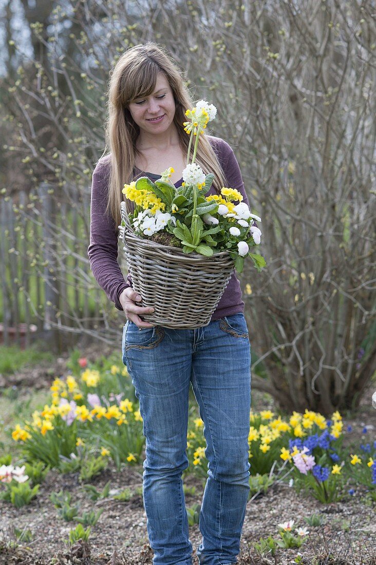 Woman with yellow-white planted basket