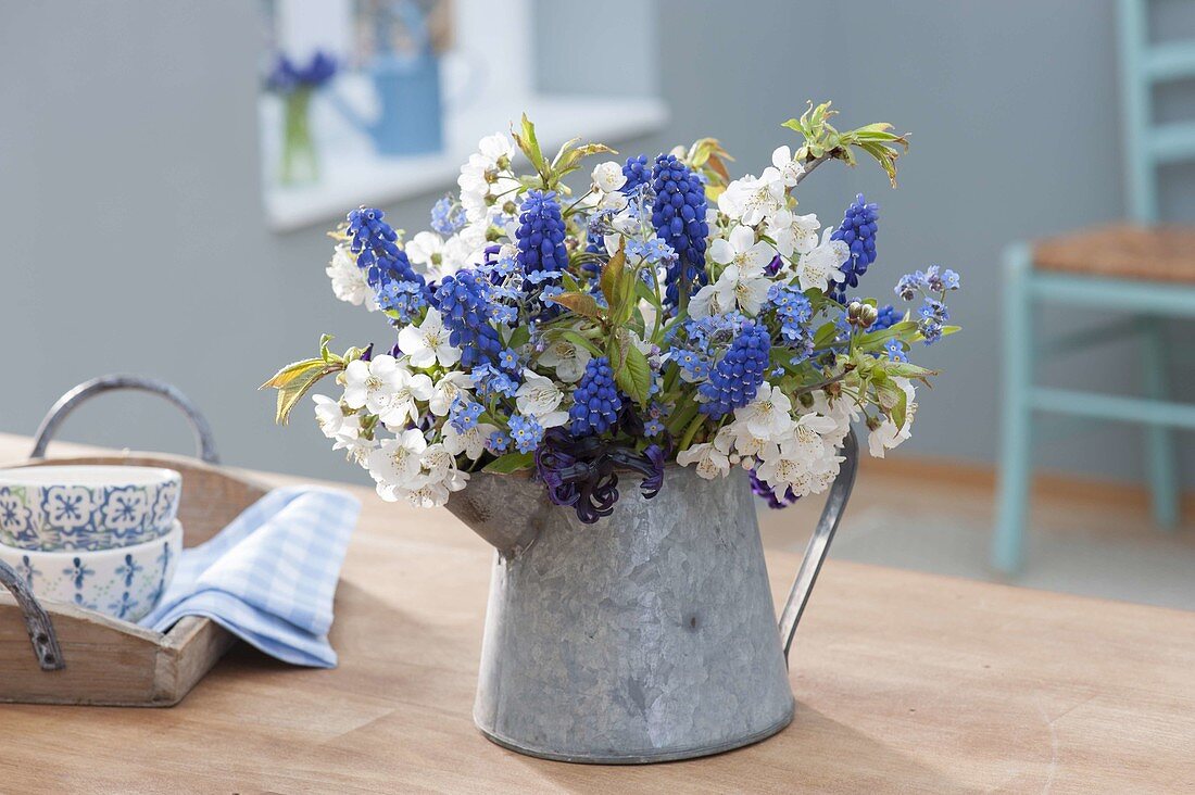 Small bouquet with branches of prunus (cherry), muscari