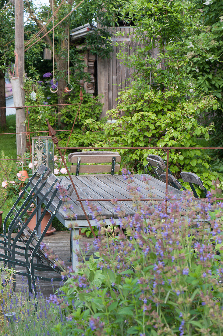 Seating on wooden deck in the natural garden