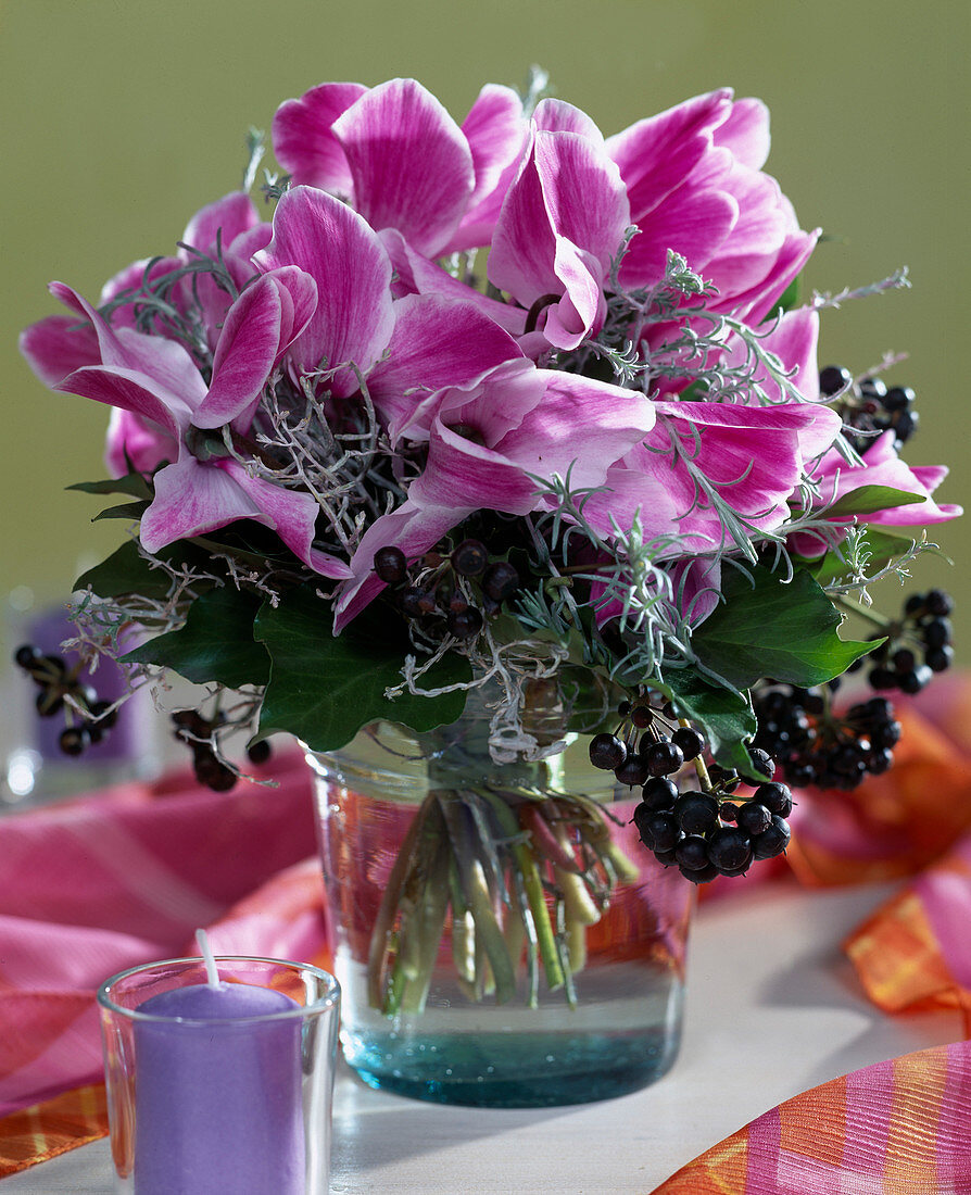 Bouquet with cyclamen, berry jewelery and curry herb