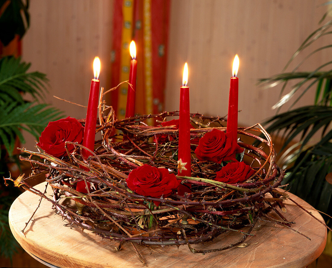 Advent wreath of dry branches with rose petals