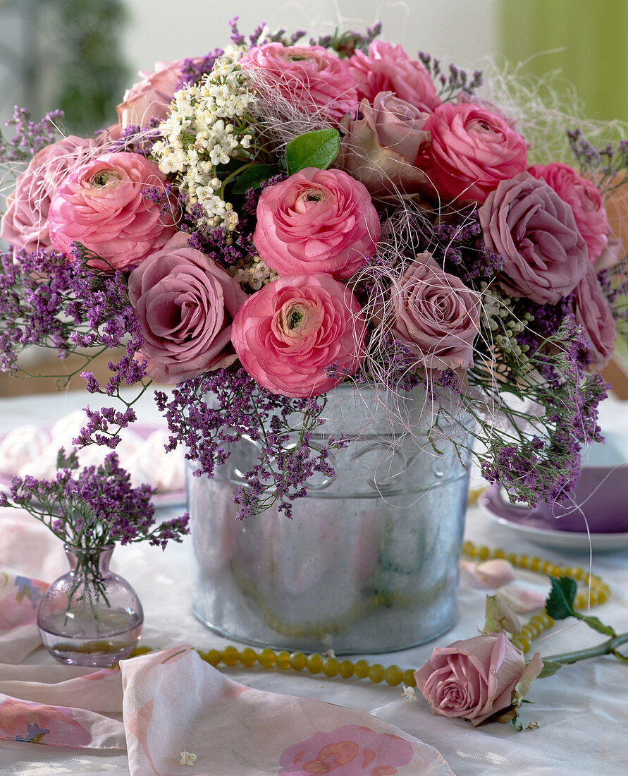 Ranunculus bouquet with roses 'Alur', blue beach lilac