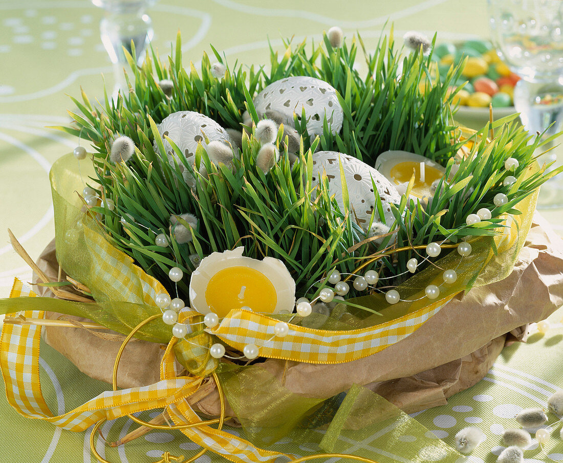 Wheatgrass seeded in a bowl and put in bag, decorated with Easter eggs