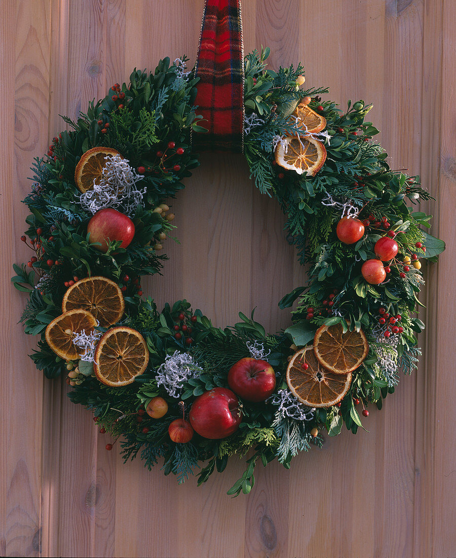 Door wreath with apples and orange slices