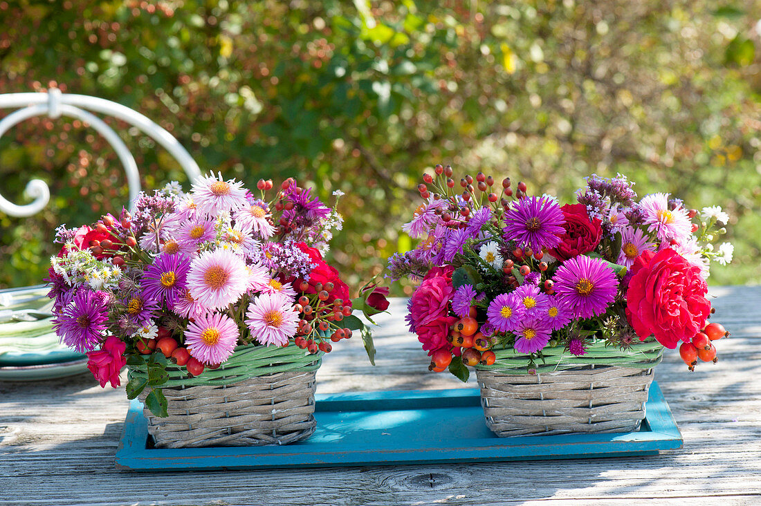 Autumn table decoration in small baskets, aster, pink