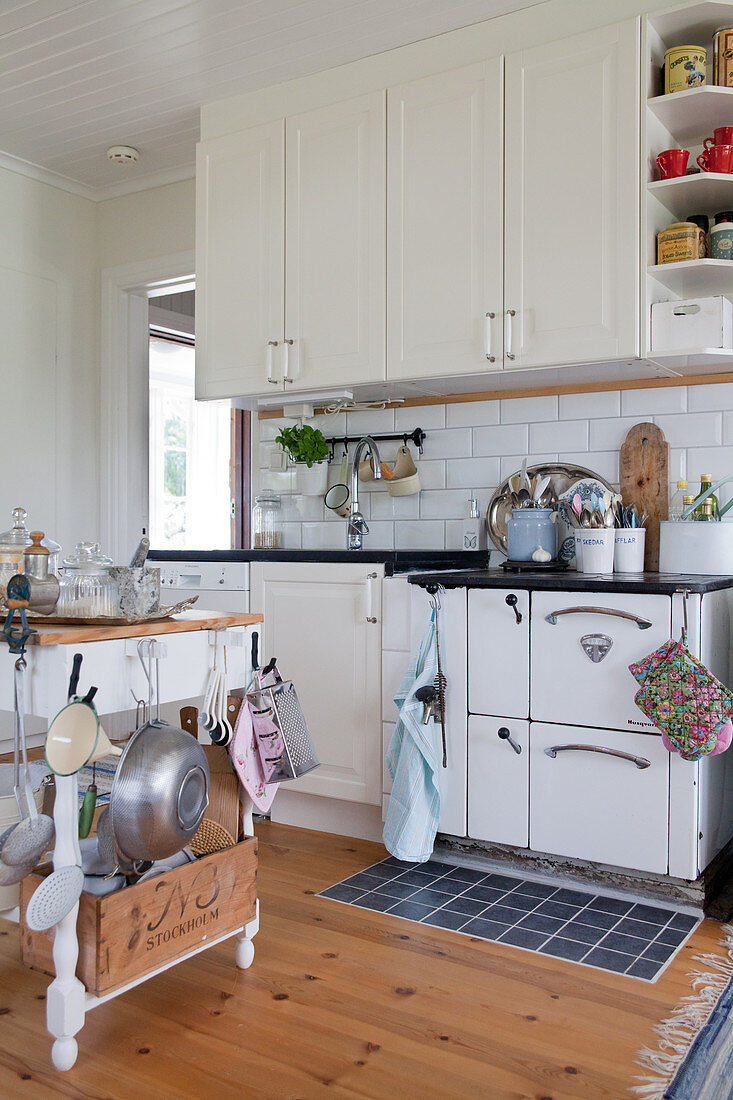 White, vintage-style country-house kitchen