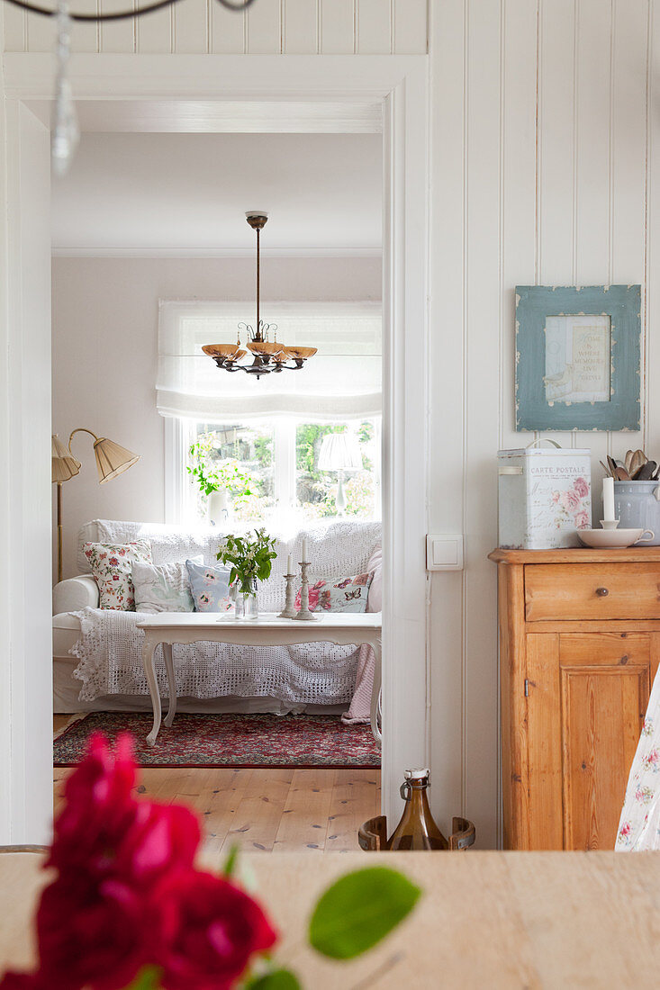 View into living room decorated in granny-chic style