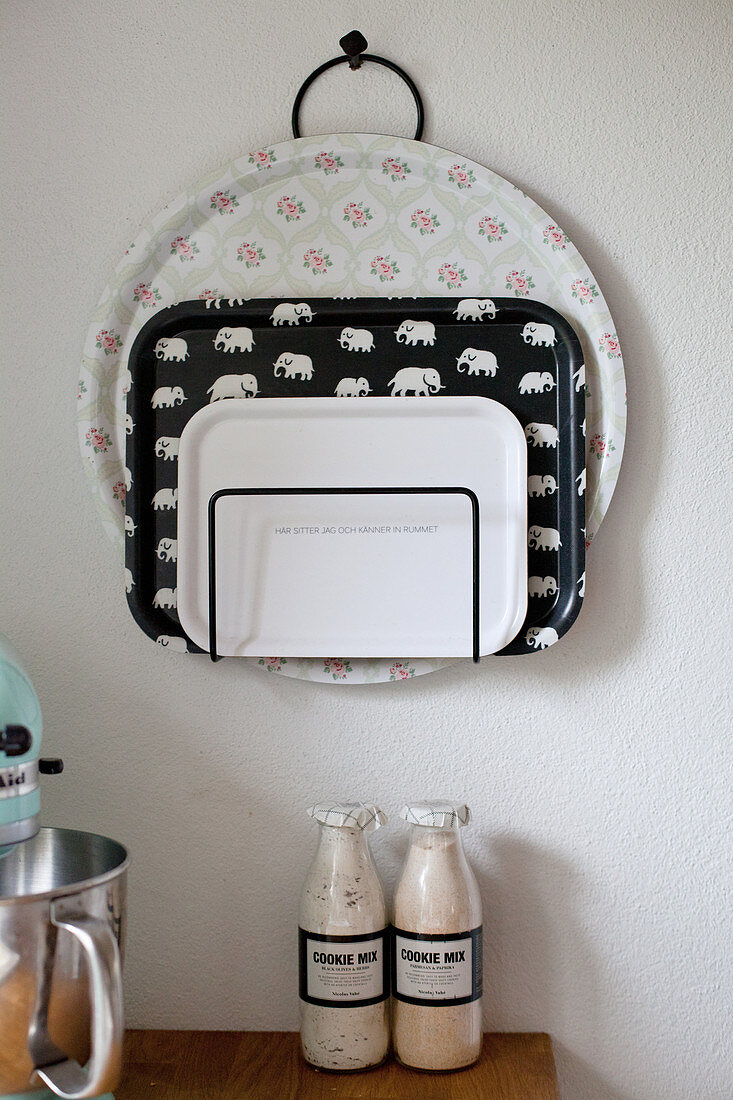 Trays in magazine rack hung on wall