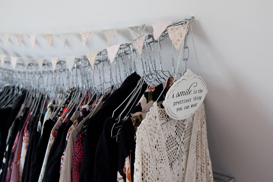 Clothing hung from chain decorated with bunting