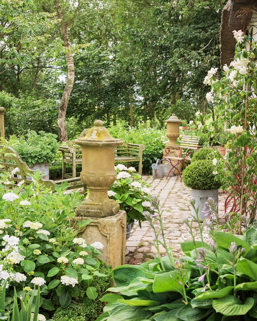 Vintage-style cobbled terrace in garden